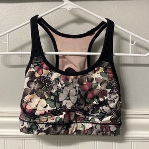 Lululemon sports bra with butterfly pattern, cross back